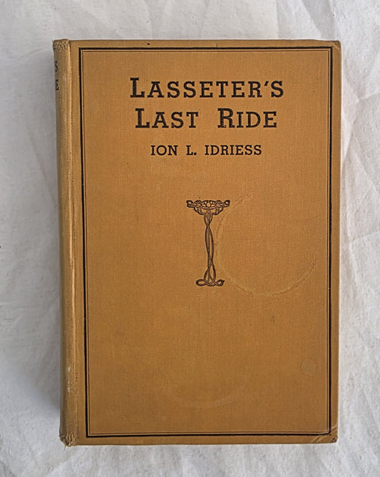 Book cover of 'Lasseter's Last Ride' by Ion L. Idriess on a textured white background