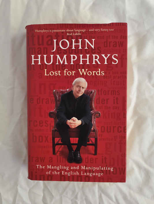 Book titled 'Lost for Words' by John Humphrys on a white background