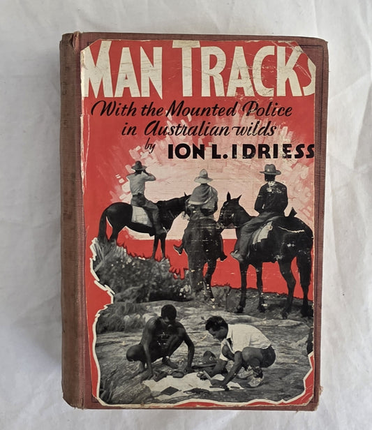 Book cover of 'Man Tracks' with mounted police and Aboriginal people in Australian wilderness, by Ion L. Idriess.