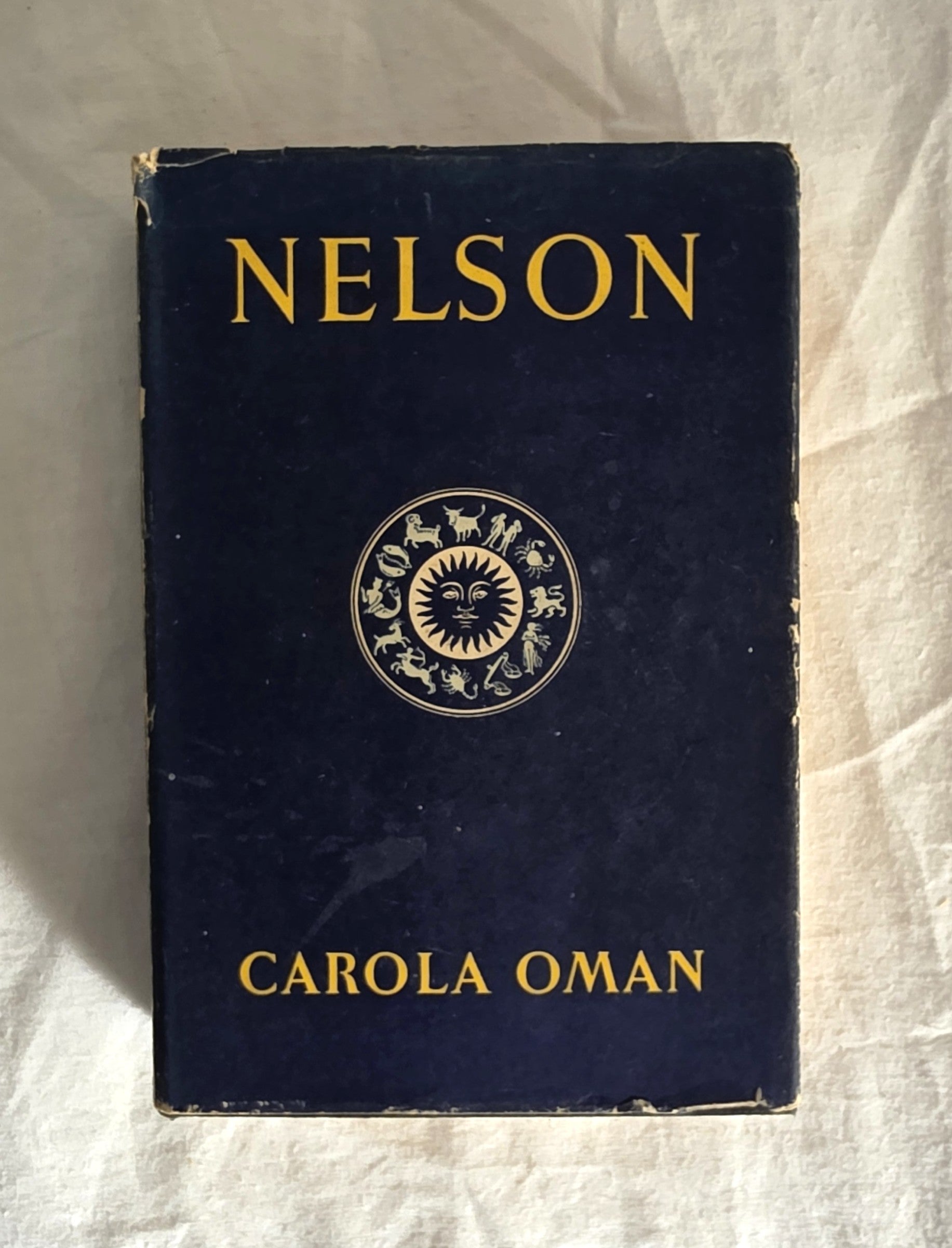 Book titled 'Nelson' by Carola Oman with a dark blue cover and gold text.
