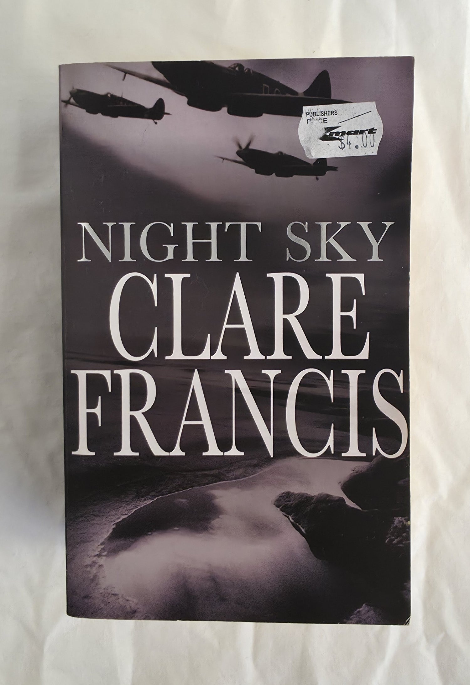 Book cover of 'Night Sky' by Clare Francis with airplane silhouettes on a dark background.