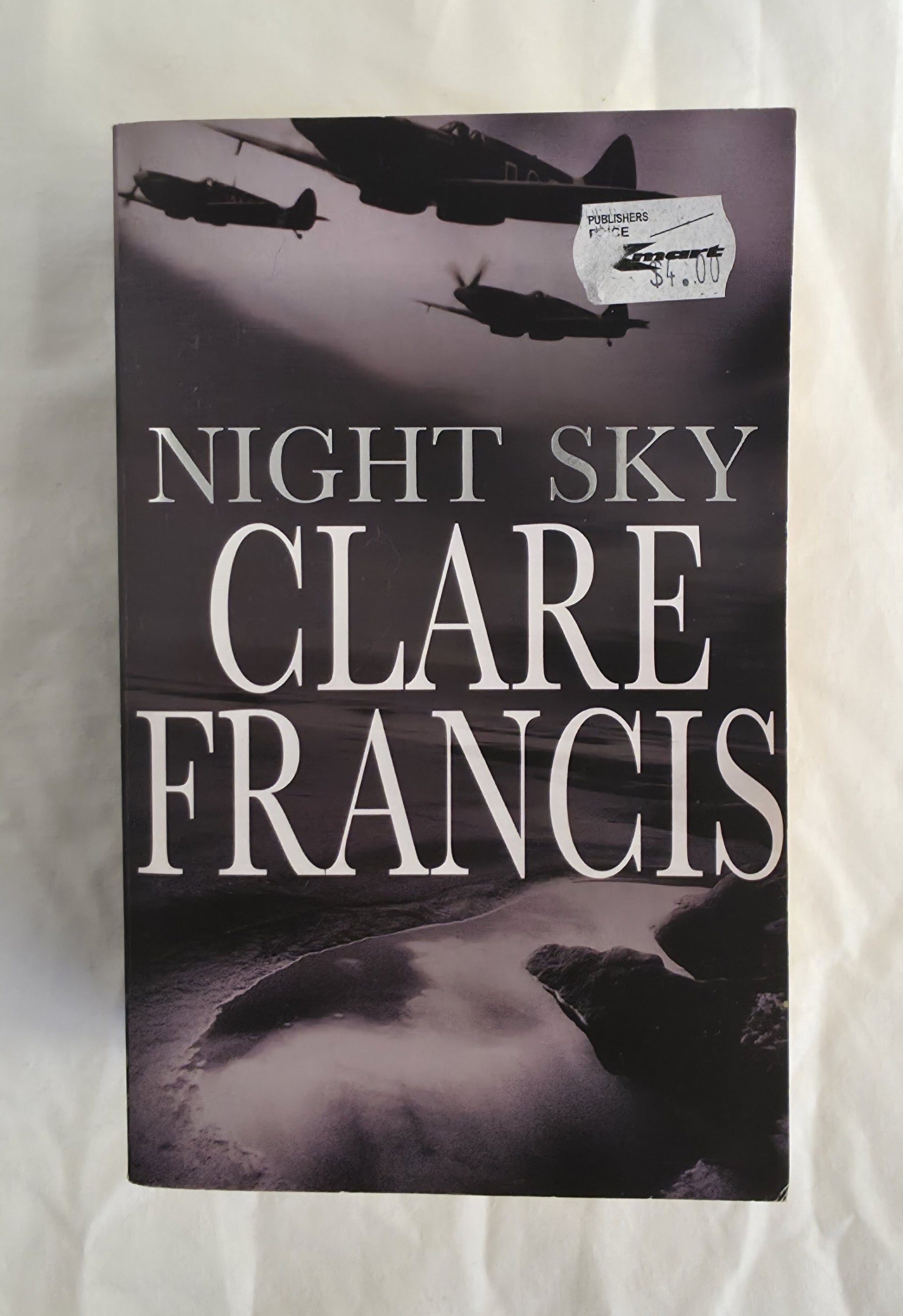 Book cover of 'Night Sky' by Clare Francis with airplane silhouettes on a dark background.