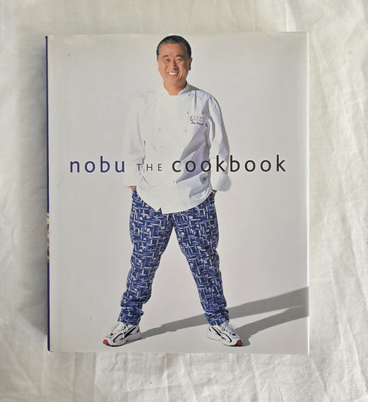 Cookbook titled 'nobu THE COOKBOOK' with a person wearing a chef's outfit on the cover.