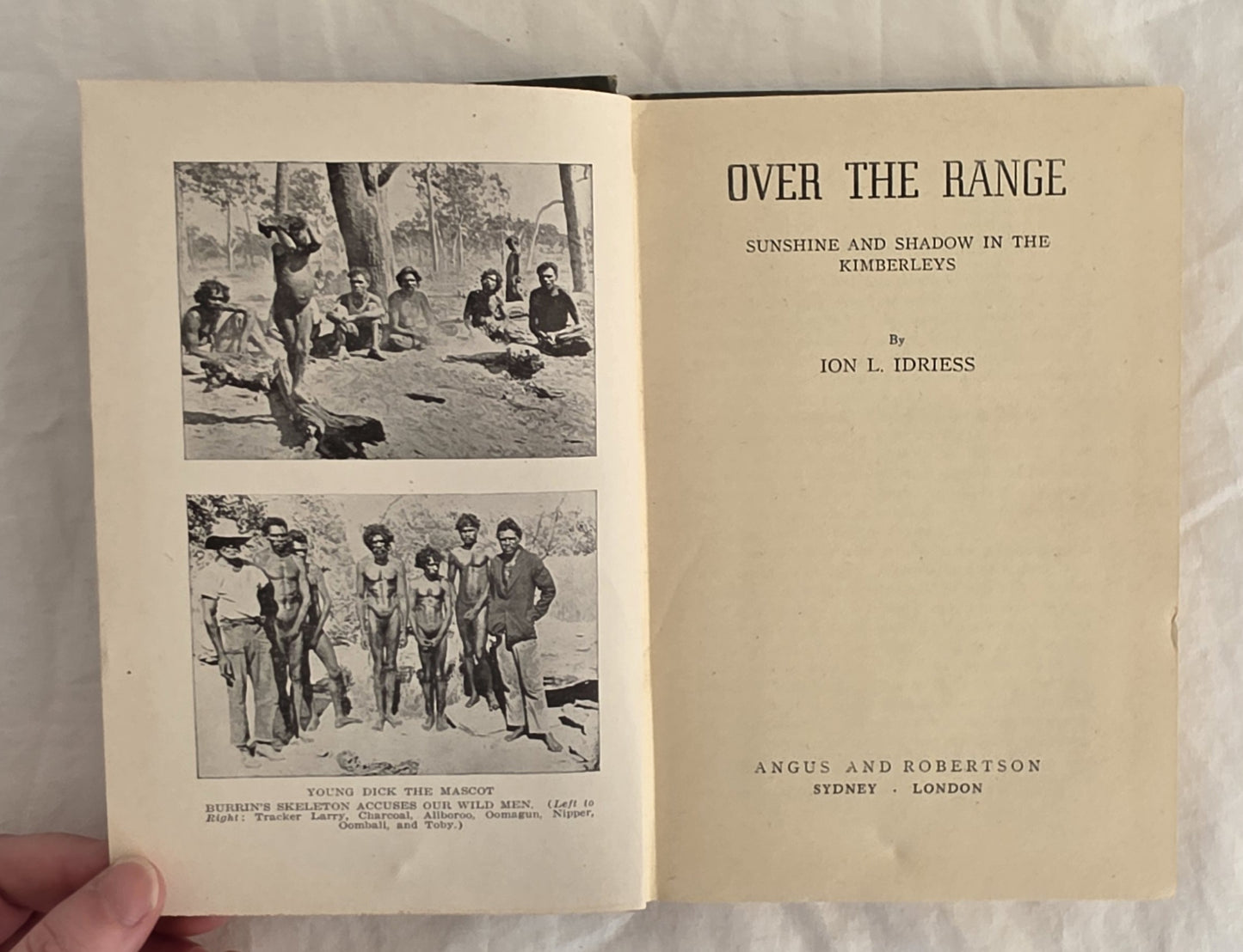 Book titled 'Over the Range' with black and white photographs on a light background
