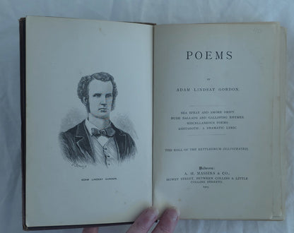 Open book with a portrait on the left page and text on the right page, held by a hand against a light background.