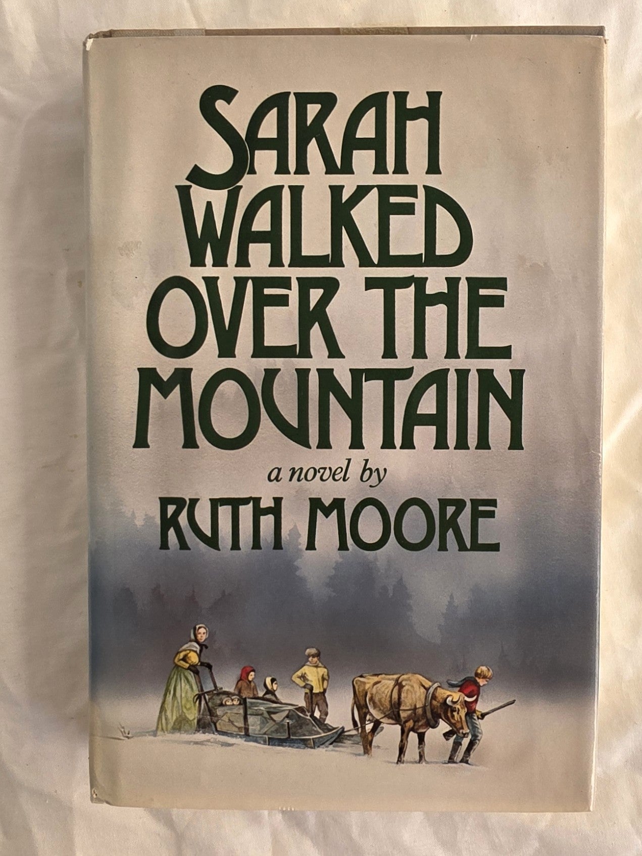 Book cover of 'Sarah Walked Over the Mountain' by Ruth Moore with a mountain and figures illustration.