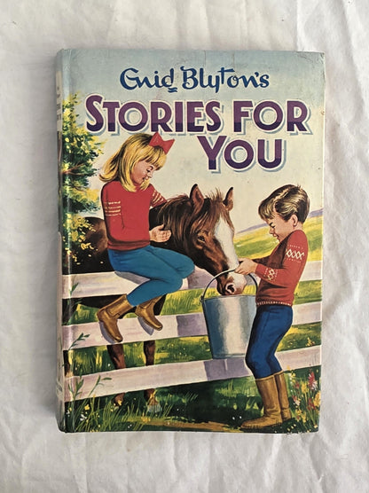 Book titled 'Stories for You' by Enid Blyton with a cover illustration of two children and a horse on a white background.