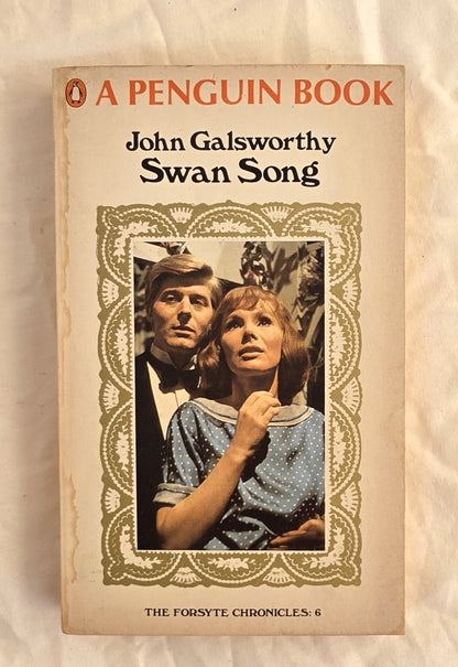 Book cover of 'Swan Song' by John Galsworthy with a couple on the cover, published by Penguin Books.