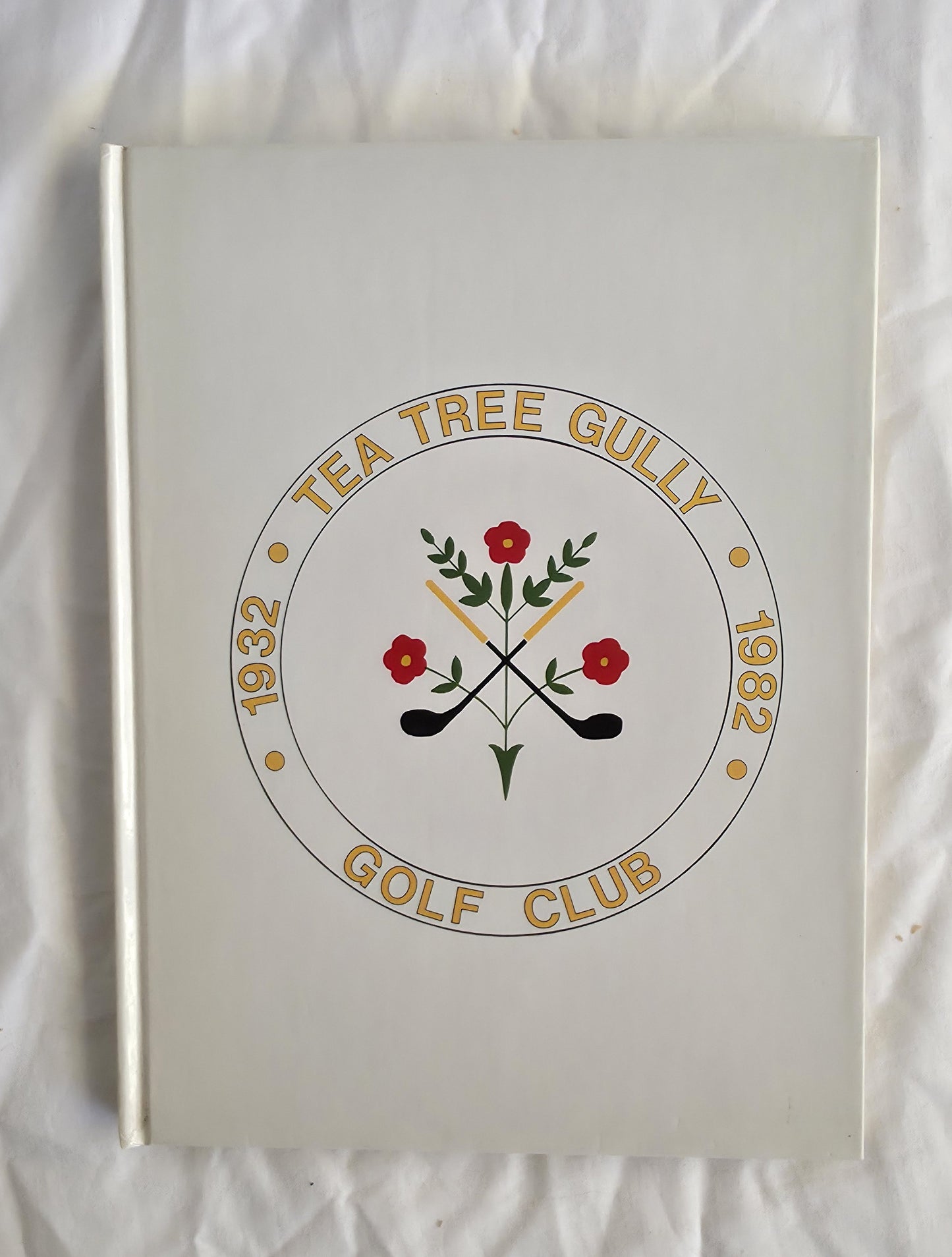 Notebook with 'Tea Tree Gully Golf Club' design on a white background