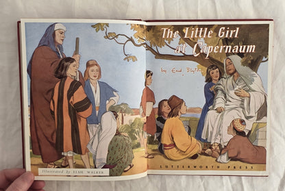 Open book titled 'The Little Girl at Capernaum' with illustrations on a plain background