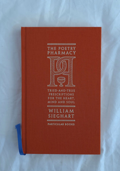 Red book titled 'The Poetry Pharmacy' by William Sieghart on a white background