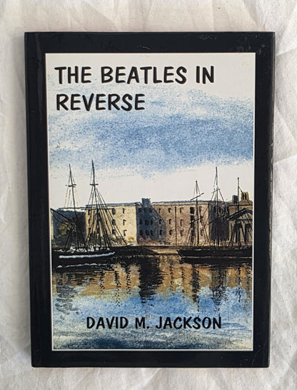 Book titled 'The Beatles in Reverse' by David M. Jackson on a textured white background