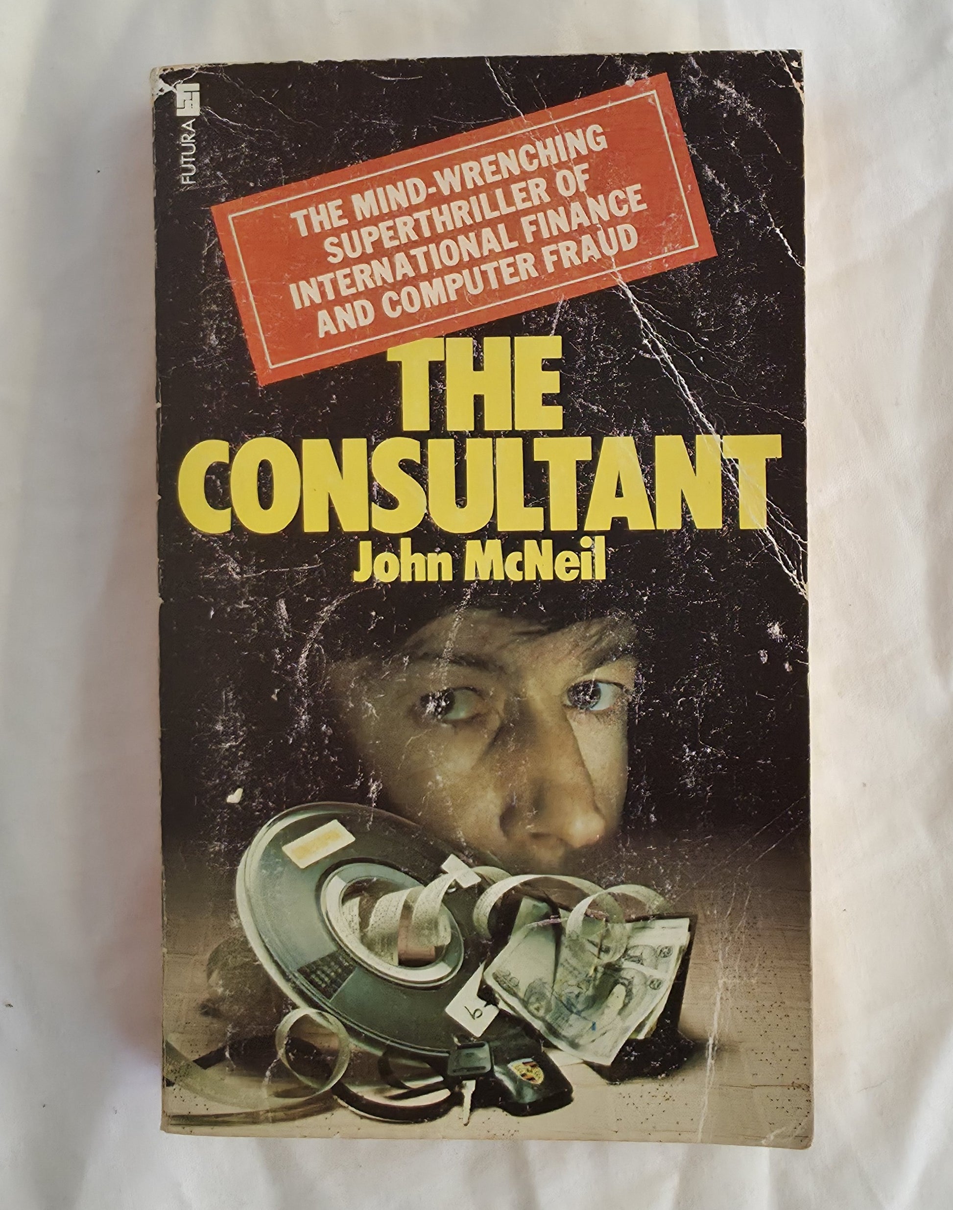 Book cover of 'The Consultant' by John McNeil with a thriller theme.