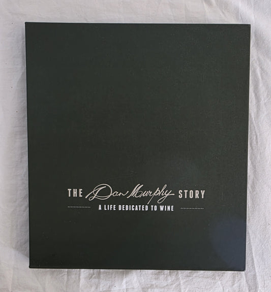 Black box with 'The Dan Murphy Story' text on a textured white background