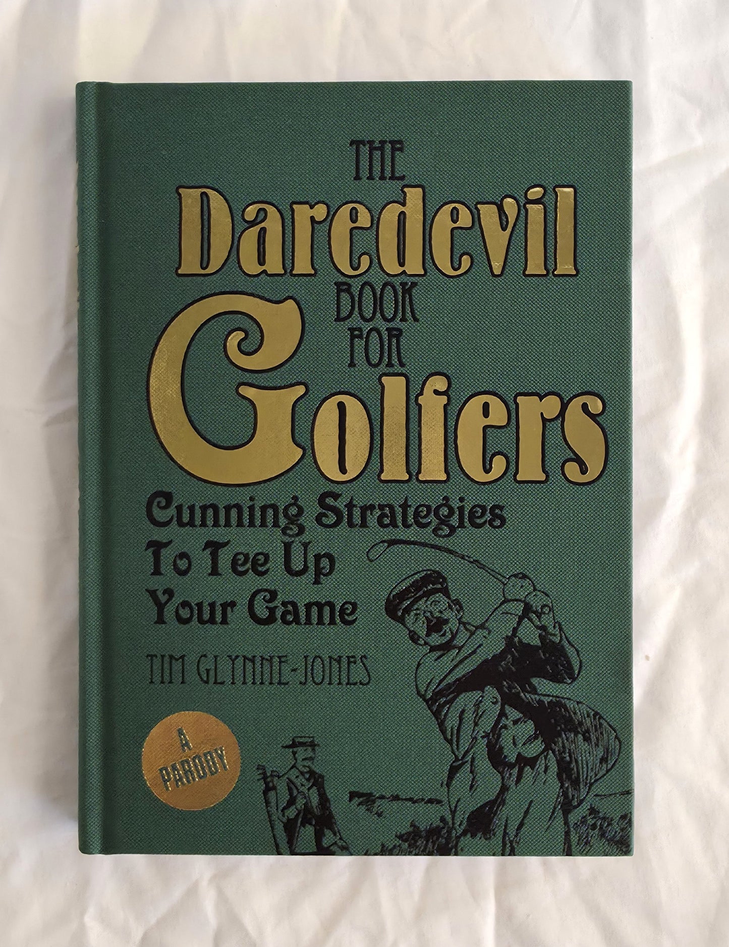 Book titled 'The Daredevil Book for Golfers' on a white background