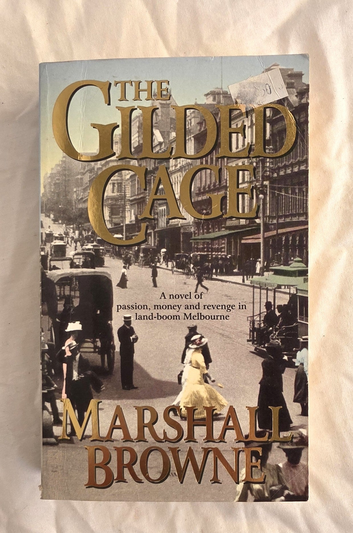Book cover of 'The Gilded Cage' by Marshall Browne on a textured beige background