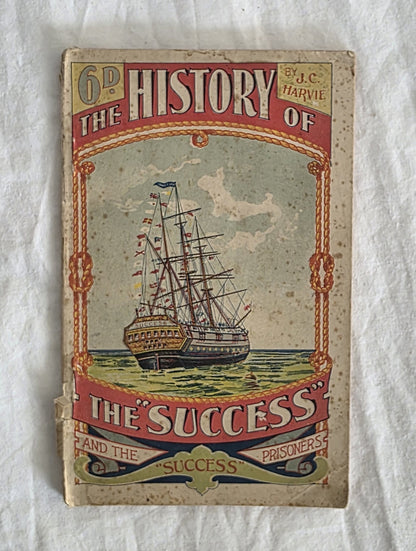 Vintage book cover with a ship illustration on a textured white background