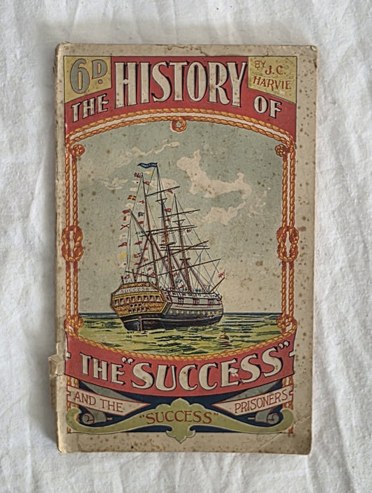 Vintage book cover with a ship illustration on a textured white background