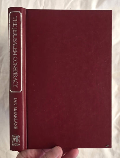 Red book titled 'The Jerusalem Conspiracy' held by a hand on a white background