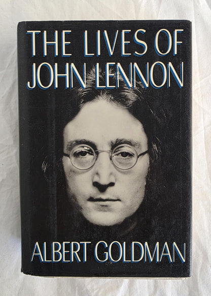 Book cover of 'The Lives of John Lennon' by Albert Goldman on a textured white background