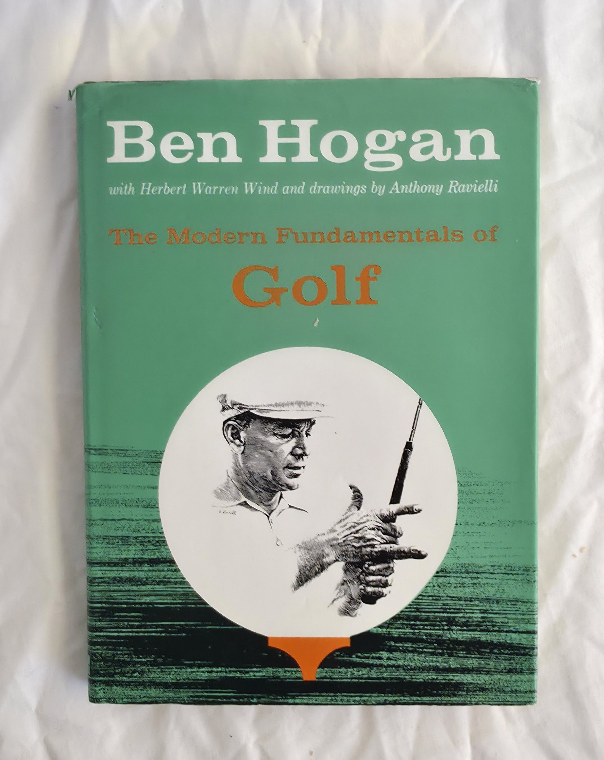 Book titled 'The Modern Fundamentals of Golf' by Ben Hogan on a white background