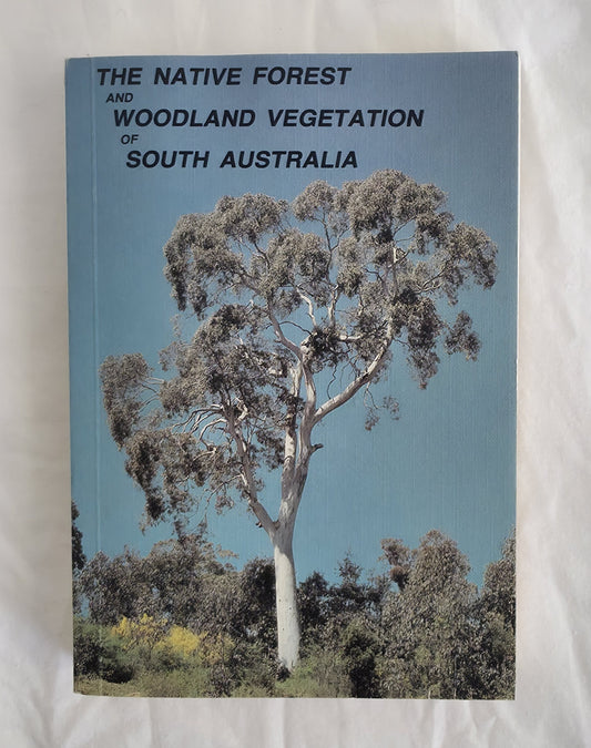 Book cover of 'The Native Forest and Woodland Vegetation of South Australia' with a tree image on a blue background.