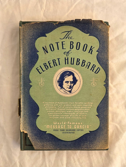 Vintage book titled 'The Notebook of Elbert Hubbard' with a green and blue cover on a white background.