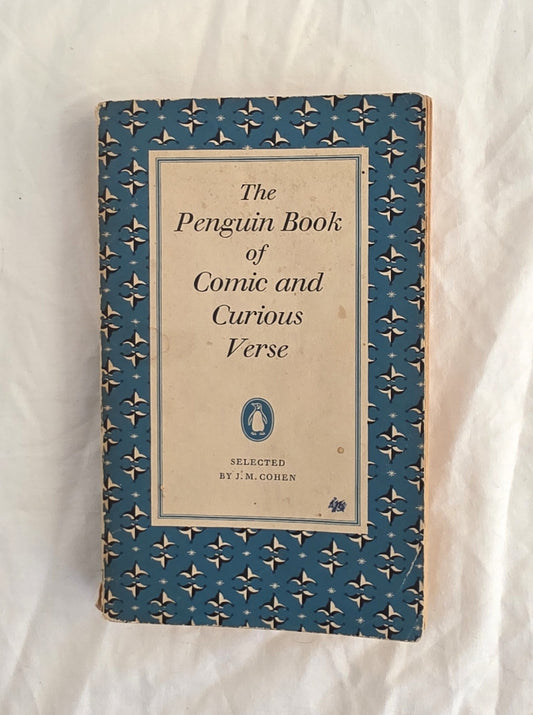 Book titled 'The Penguin Book of Comic and Curious Verse' on a textured white background
