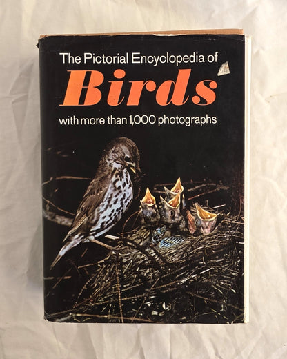 Book titled 'The Pictorial Encyclopedia of Birds' with a bird and chicks illustration on a black background.