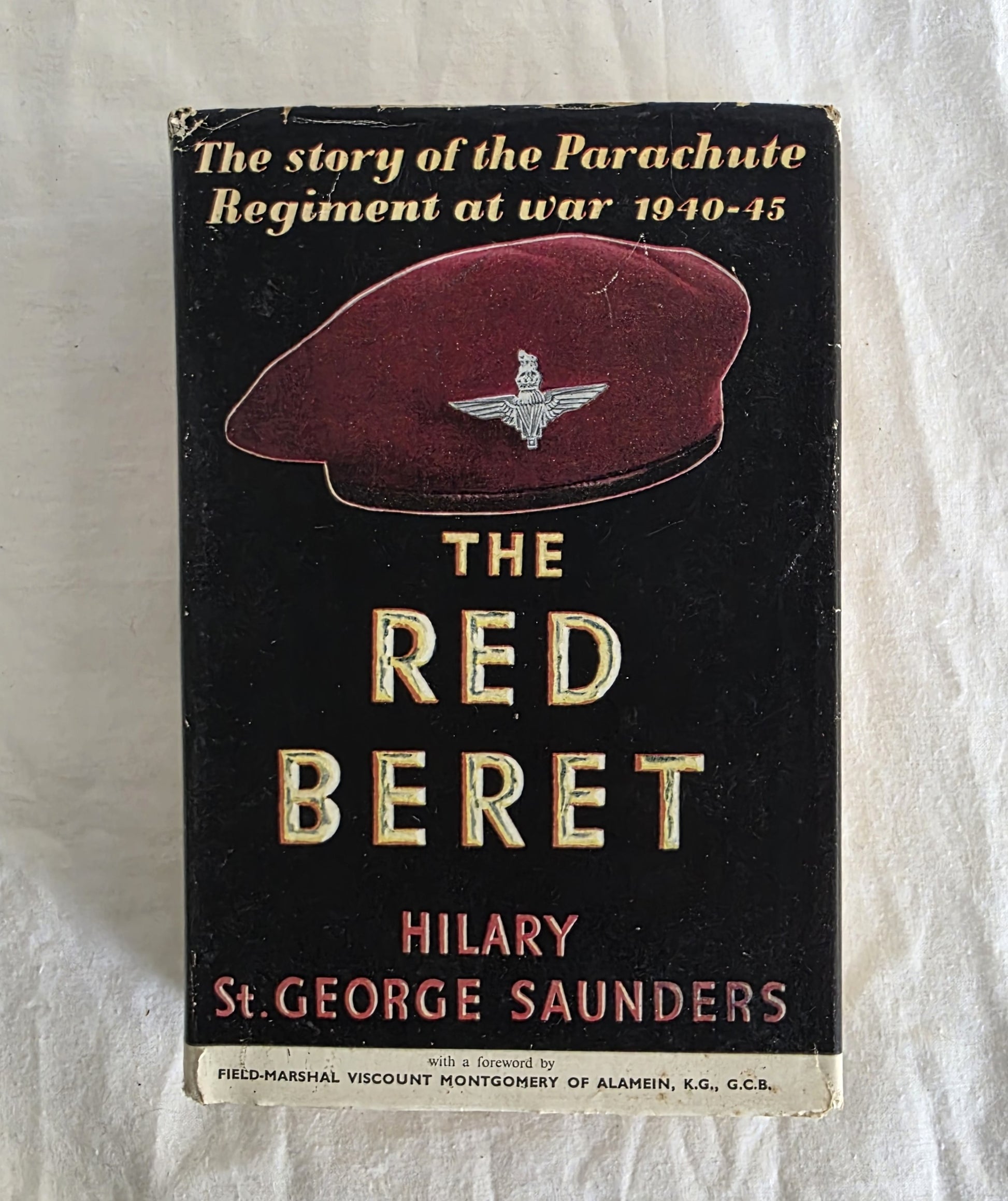 Book cover of 'The Red Beret' by Hilary St. George Saunders on a textured white background