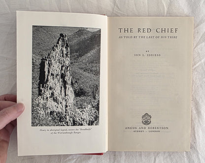 Open book titled 'The Red Chief' with a black and white photograph on the left page.