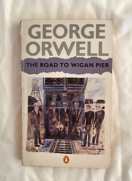 Book cover of 'The Road to Wigan Pier' by George Orwell on a textured white background