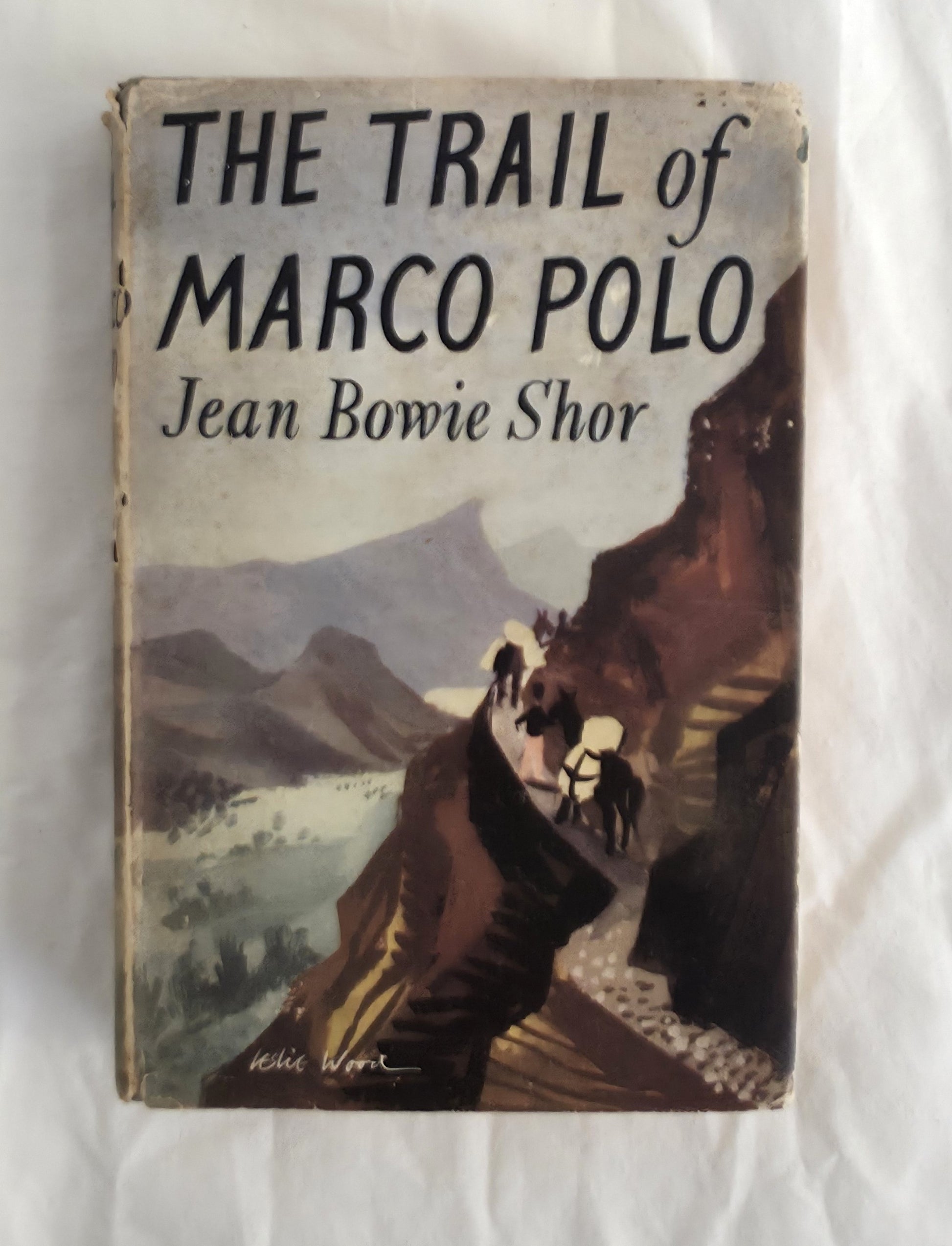Book cover of 'The Trail of Marco Polo' by Jean Bowie Shor with a mountainous landscape illustration.