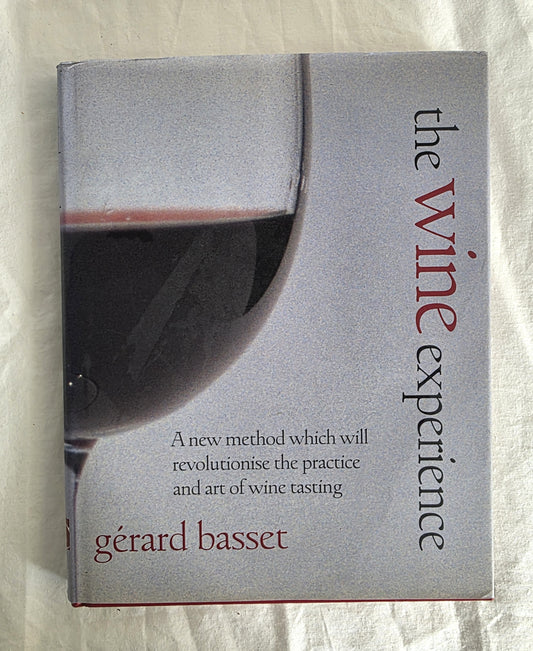 Book titled 'The Wine Experience' by Gerard Basset with a glass of red wine on the cover.