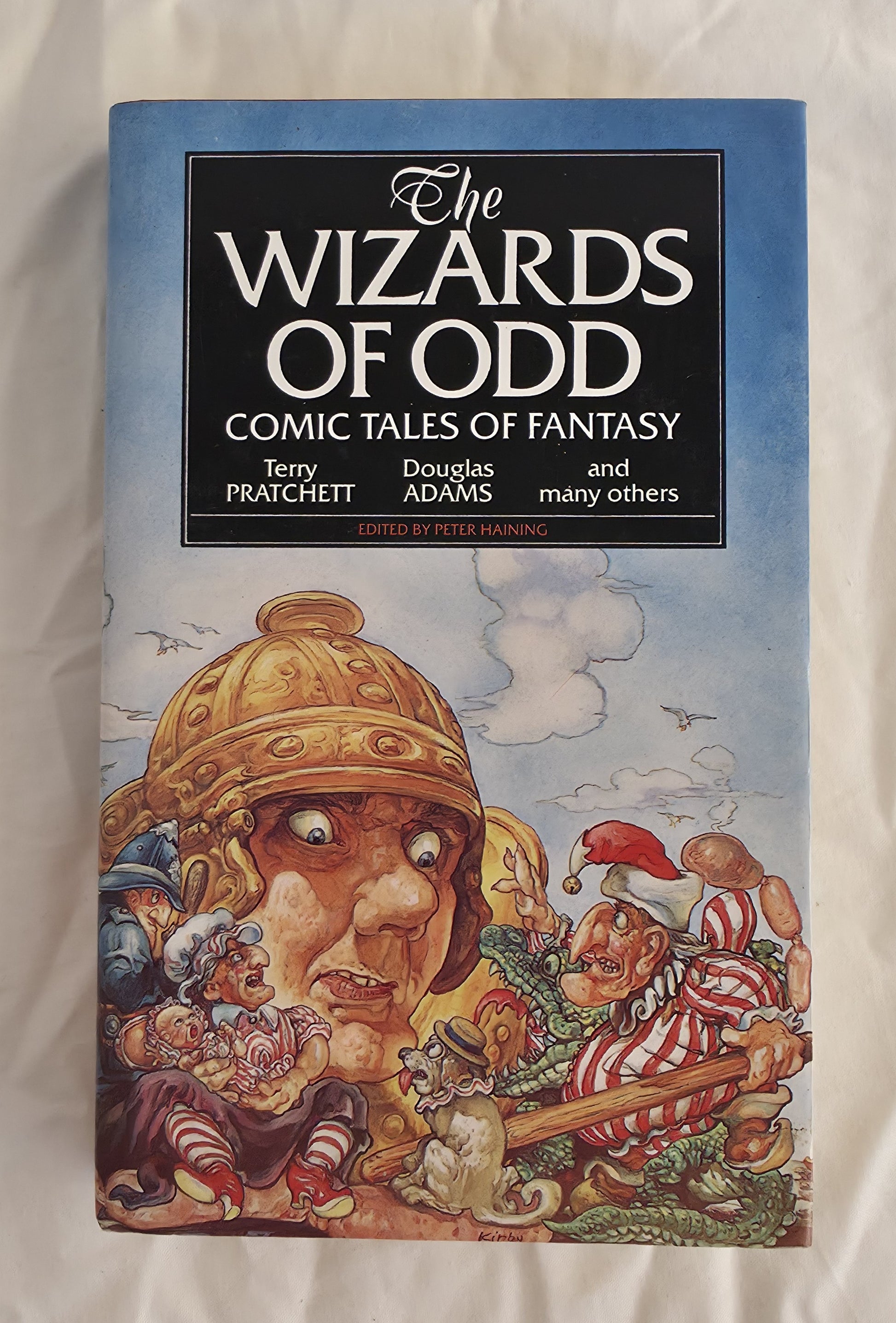 Book cover of 'The Wizards of Odd' with a fantasy illustration on a white background