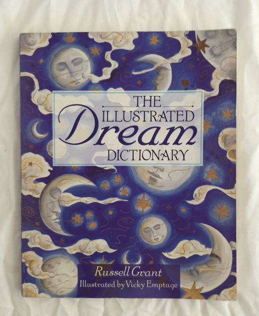 Book titled 'The Illustrated Dream Dictionary' with celestial designs on the cover.