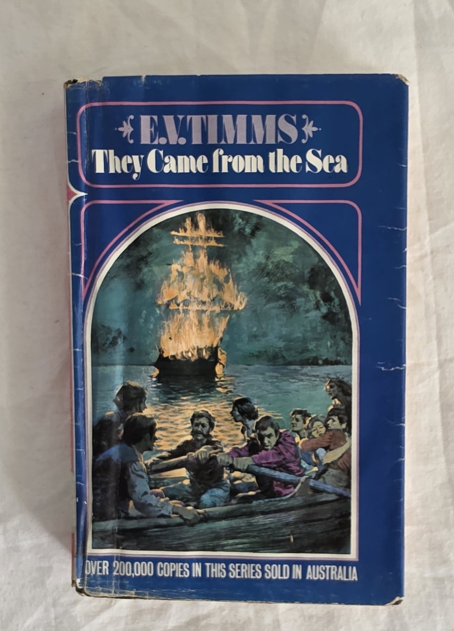Book cover of 'They Came from the Sea' by E. Timms with a ship on fire illustration.