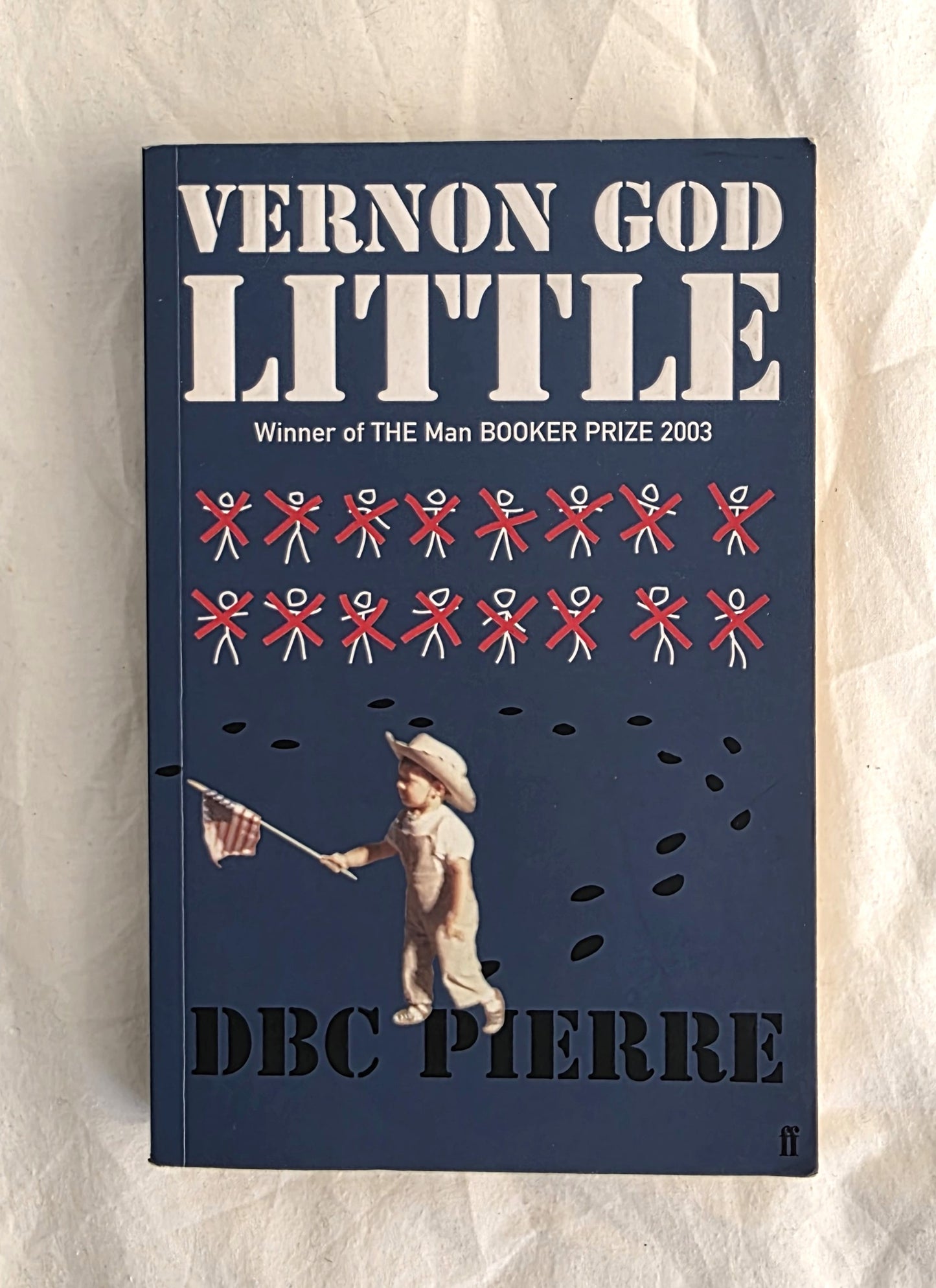 Book cover of 'Vernon God Little' by DBC Pierre on a textured beige background