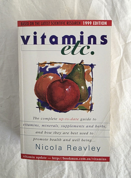 Book titled 'vitamins etc.' by Nicola Reavley on a textured white background