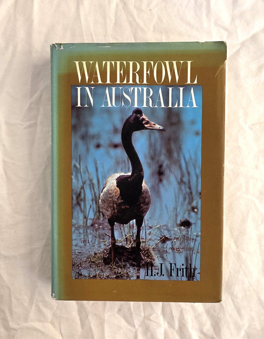 Book titled 'Waterfowl in Australia' with a duck on the cover, placed on a textured surface.