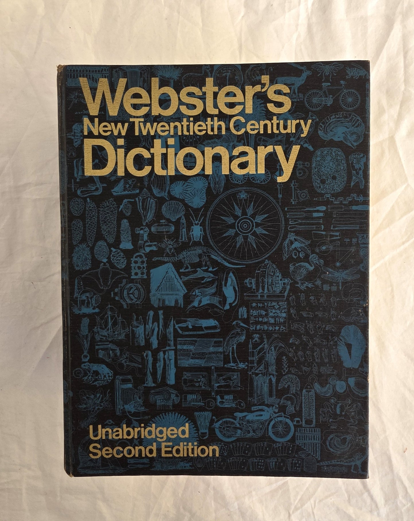 Webster's New Twentieth Century Dictionary on a textured white background