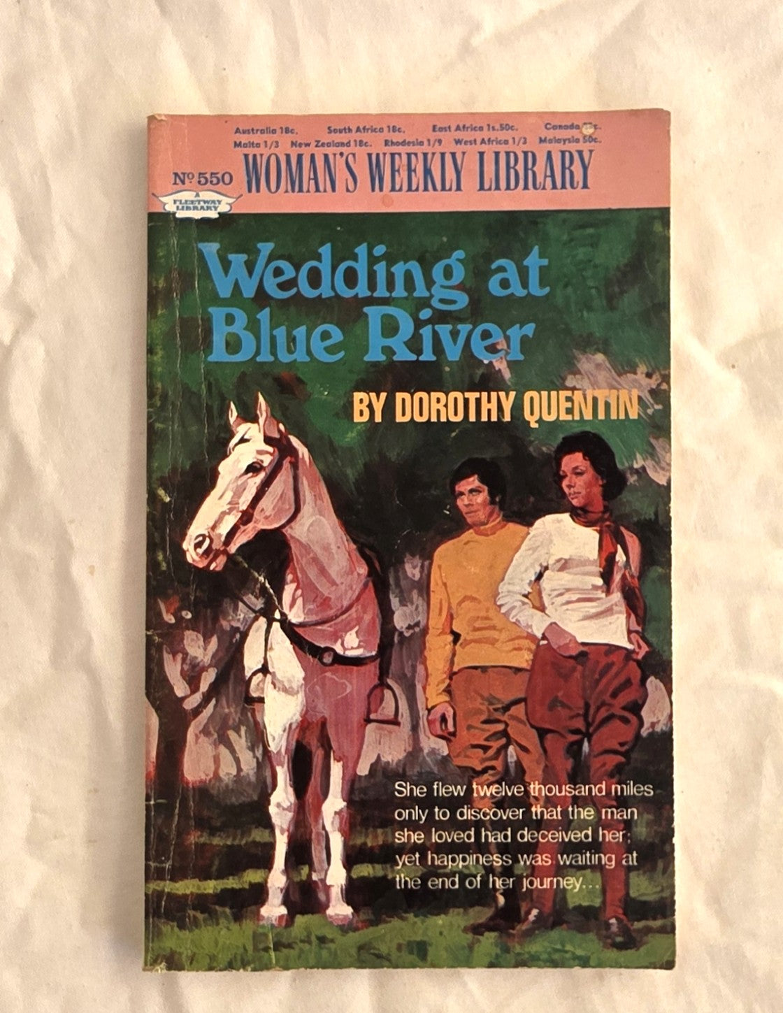 Book cover of 'Wedding at Blue River' by Dorothy Quentin with a horse and two people on a beige background