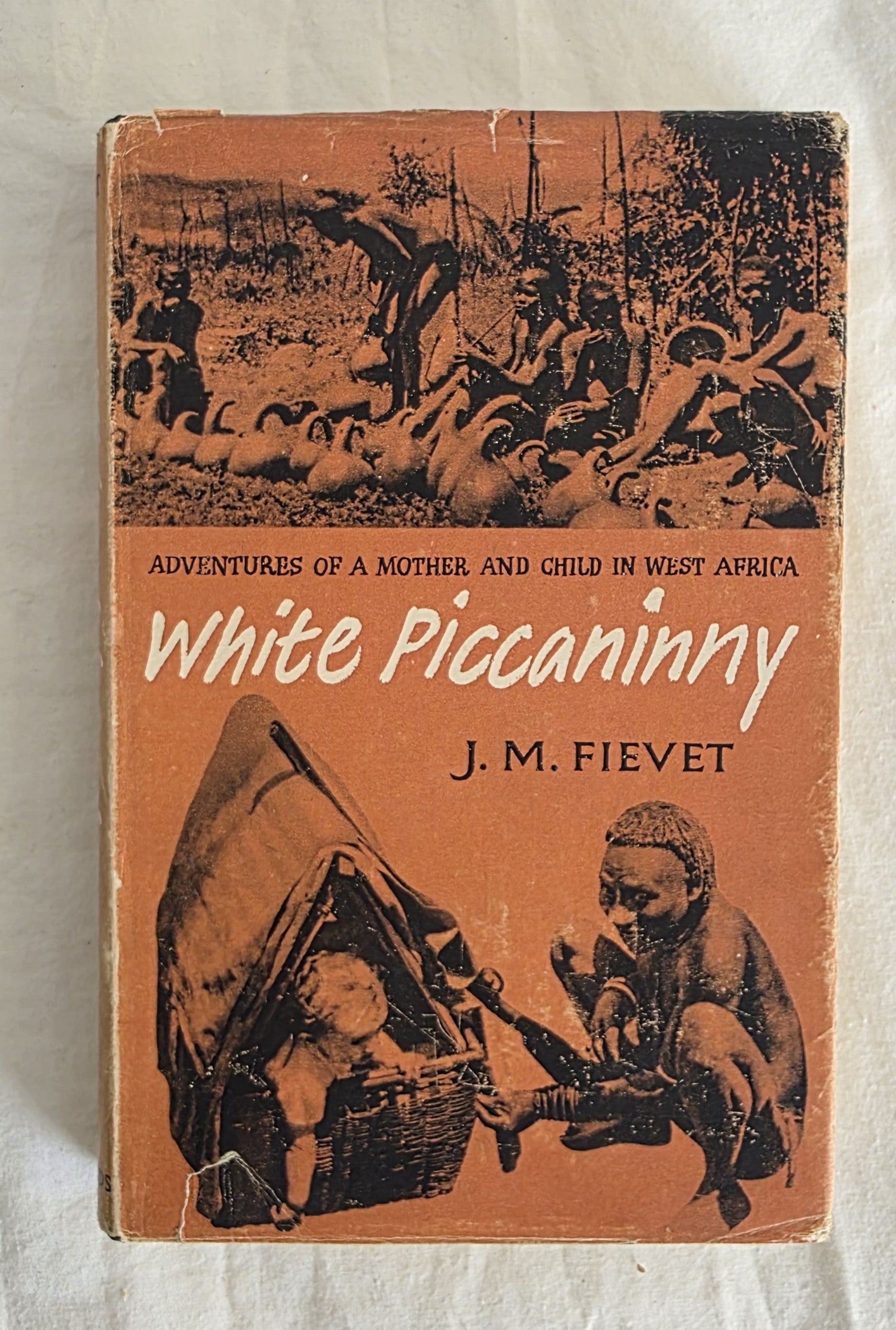 Book cover of 'White Piccaninny' by J.M. Fievet on a textured beige background