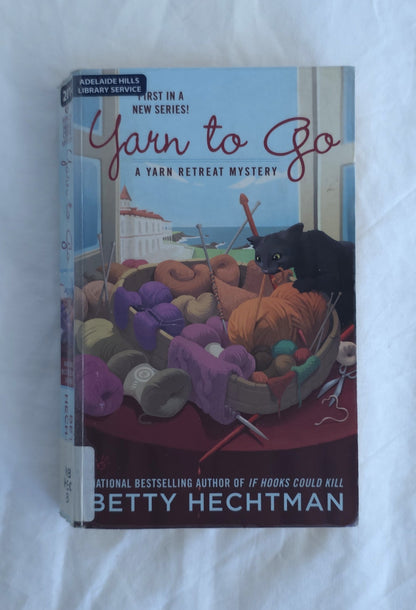 Book titled 'Yarn to Go' by Betty Hechtman on a white background