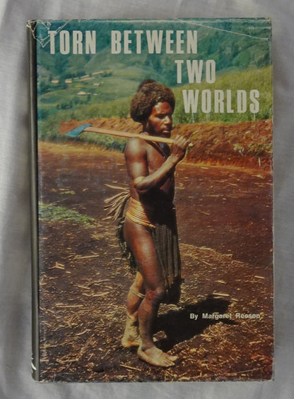 Torn Between Two Worlds by Margaret Reeson